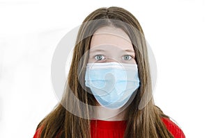 Beautiful teenage girl wearing medical face mask because of air, Teenage girl social distancing from corona virus covid-19.