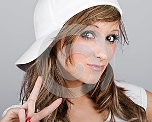 Beautiful Teenager Girl in a White Baseball Cap