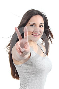 Beautiful teenager making the victory or peace gesture