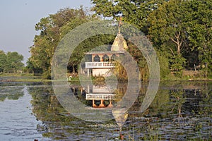 Beautiful Temple at the bank of Wetland with its Mirror Image