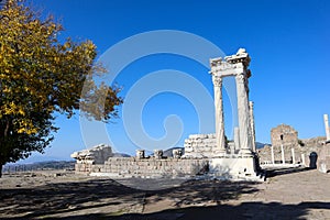 Beautiful temple of Trajan with white marble columns on blue sky background, ancient city Pergamon, Turkey