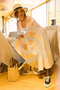 Beautiful tender woman in white dress posing. Beauty, fashion. Haircare. Cosmetics.