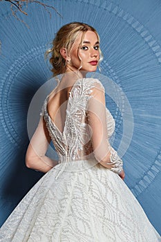 Beautiful tender young woman sexy blond bride in a luxury white wedding dress lace chiffon Summer happiness awaits the groom