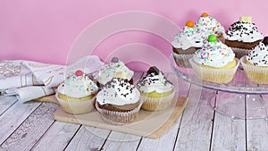 Beautiful testy Cupcakes decorated with cream served on the table
