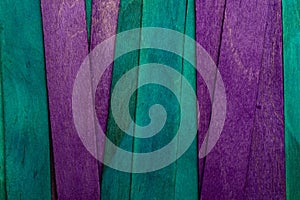 Beautiful texture of natural wood slats in purple and blue colors turquoise.