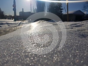 Beautiful texture of snow cover in the sun