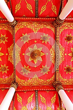 Beautiful Thai style decoration on the ceiling of the temple of Thailand.