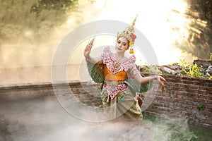 Beautiful Thai young woman portrait in Kinnaree traditional dress costume Art culture Thailand Dancing in masked khon Kinnaree in