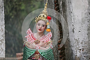 Beautiful Thai young woman portrait in Kinnaree traditional dress costume Art culture Thailand Dancing in masked khon Kinnaree in