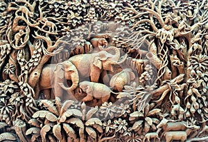 Beautiful Thailand Antique Art Handmade Furniture. Carvings Elephant Family in The Wood on The Wooden Frame used as Antique Design