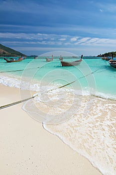Beautiful Thailand travel island Koh Lipe white sand beach with boat in the sea and blue sky landscape background