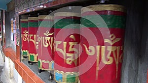 Beautiful Tibetan buddhist prayer wheels in motion,Dharamsala, India
