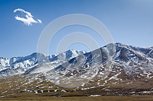 Beautiful Tibetan high mountain landscape with the lonely cloud