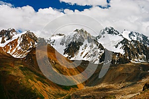 Beautiful Tien shan peaks and mountains near Almaty. Dramatic overcast sky. Beauty world.