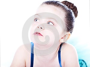 Beautiful toddler ballerina on white background