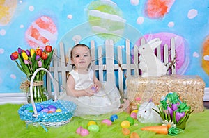 Beautiful toddler girl in easter scene