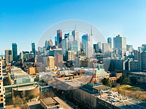 Beautiful Toronto skyline of skyscrapers and financial district from above building roofs