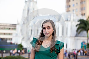 Beautiful tourist girl at the Ortiz Bridge with La Ermita church on background in the city of Cali in Colombia photo