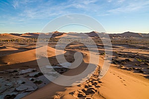 Beautiful towering red sand dunes at famous Deadvlei near Sossusvlei in Namib desert, Namibia, Southern Africa