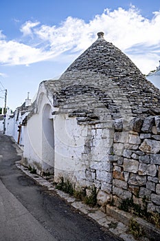 Beautiful town of Alberobello with typical trulli houses built from stone, main touristic district, Apulia region, Southern Italy