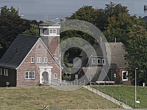Beautiful traditional brick building - is an observation tower at the entrance to the port of Emden