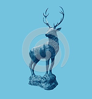 Beautiful and traditional british Deer Stag bronze, or alloy statue or sculpture cut out against a pale blue background