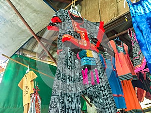 Beautiful traditional handmade clothes for sale to the tourist as the souvenir at the local market in hill tribe minority village