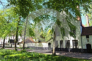 Beautiful traditional houses in the old town of Bruges dutch: Brugge, Belgium. Spring landscape photo