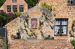 Beautiful traditional houses in the old town of Bruges dutch: Brugge, Belgium. Spring landscape photo