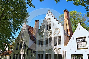 Beautiful traditional houses in the old town of Bruges dutch: Brugge, Belgium. Spring landscape photo