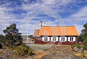 Beautiful traditional red wooden church in Holick