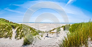 Beautiful tranquil dune landscape and long beach at North Sea, Germany photo