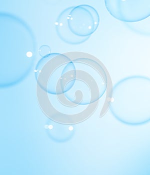 Beautiful Transparent Blue Soap Bubbles Floating in The Air. Blue Gradient Blurred Background