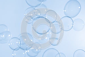 Beautiful Transparent Blue Soap Bubbles Floating as Background.
