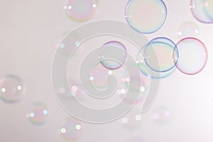Beautiful transparent colorful blue and pink soap bubbles floating background.