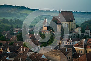 Beautiful Transylvanian saxon village and fortified church in morning sunlight