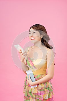 Beautiful travel girl using smart phone isolated on white background