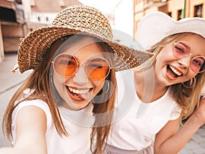 Beautiful trendy girls posing in the street