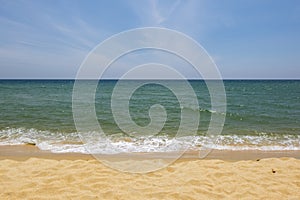 Beautiful tropical beach, soft wave hitting sandy beach under brighter sunny day