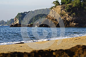 Beautiful tropical beach, soft wave hitting sandy beach under brighter sunny day