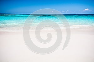 Beautiful tropical beach, white sand and blue sky background.