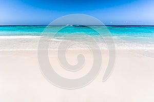 Beautiful tropical beach, white sand and blue sky background wit