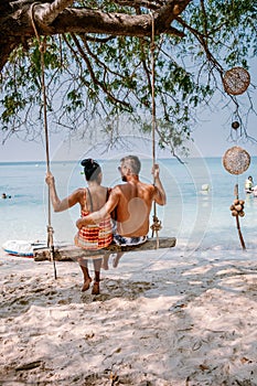 Beautiful tropical island beach - Koh Kham, Trat Thailand Pattaya Asia, couple relax on tropical Island