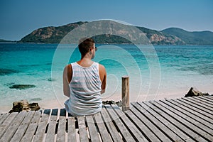 Beautiful tropical island beach - Koh Kham, Trat Thailand Pattaya Asia, men relax on tropical Island