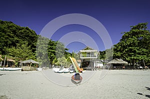 Beautiful tropical island and resort at sunny day. white sandy beach with blue sky background