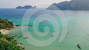 Beautiful tropical landscape with boats in a bay at Phi Phi islands in Thailand.