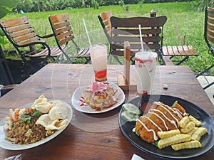 Beautiful tropical lunch menu : fish fillet, fried rice and milky freshy beverage