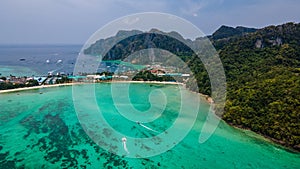 Beautiful tropical panoramic landscape with boat in the ocean at Phi Phi islands in Thailand.