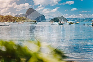 Beautiful tropical scenery. El-Nido, Philippines. Banca boats resting on tranquil early morning at Corong Corong lagoon.