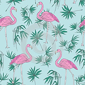 Beautiful tropical seamless pattern with pink flamingo birds and green jungle palm foliage hand drawn on blue background
